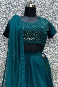 Nirmal Creations green Satin lehenga with mirror work blouse