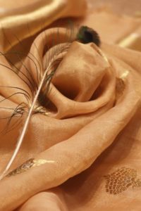 Nirmal Creations Peach Gold Tissue Saree